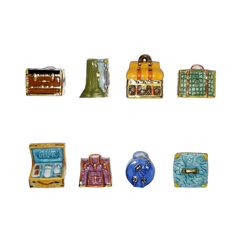Série complète de 8 fèves Bagages royaux 2004